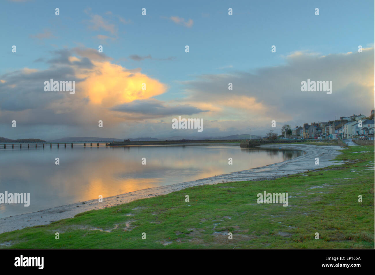 View of Arnside seafront and the Kent estuary and viaduct in early morning. Cumbria, England. November. Stock Photo