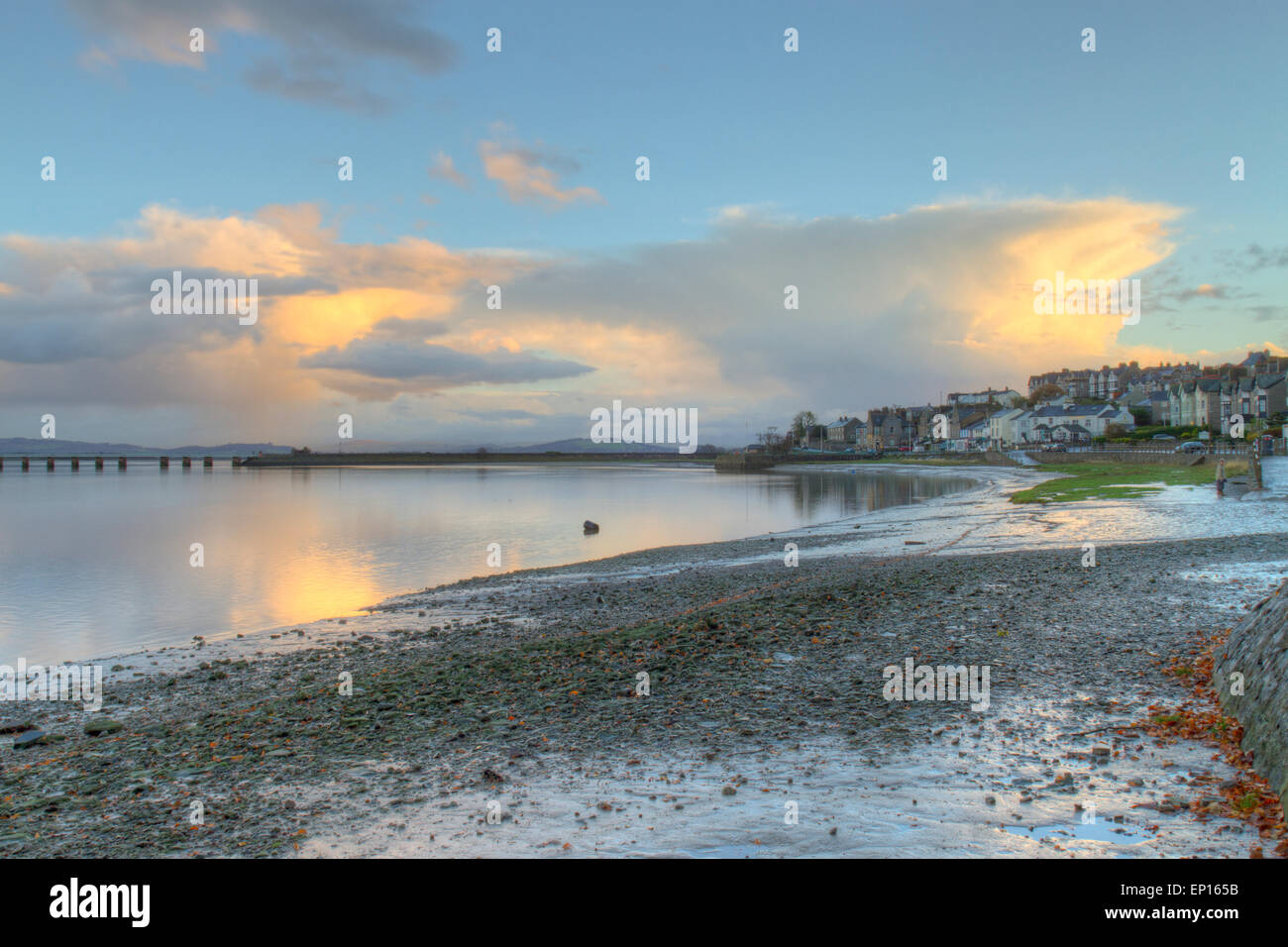 View of Arnside seafront and the Kent estuary and viaduct in early morning. Cumbria, England. November. Stock Photo