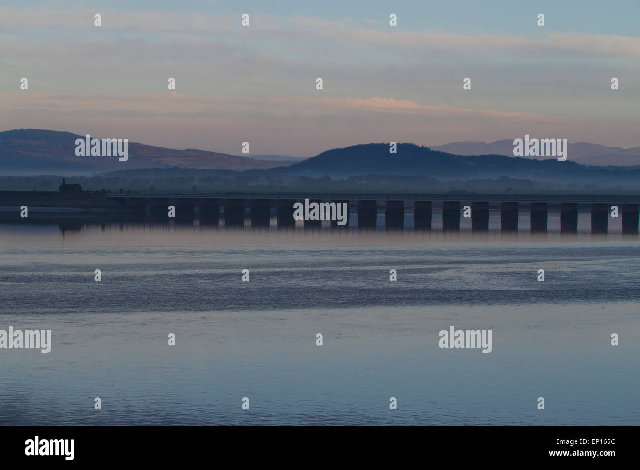 View across the Kent estuary to the viaduct in early morning. From Arnside, Cumbria, England. November. Stock Photo