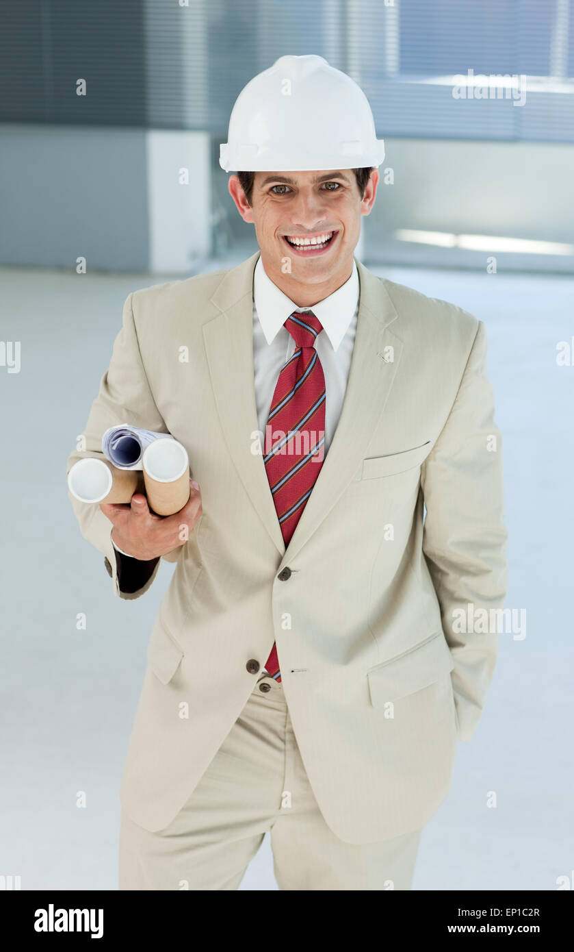 Attractive architect holding blueprints Stock Photo Alamy