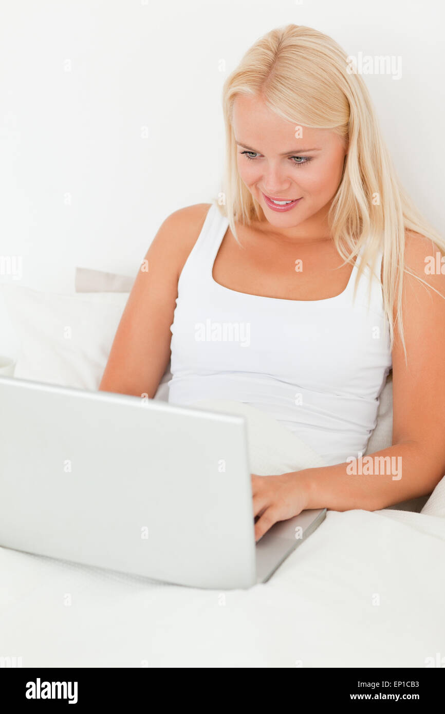 Portrait of a woman using a laptop Stock Photo - Alamy