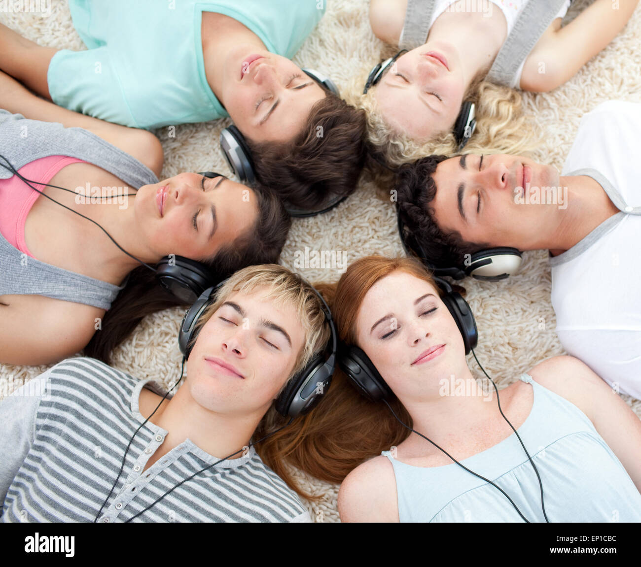 High angle of teenagers listening to music Stock Photo - Alamy