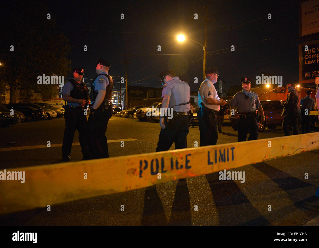 Philadelphia, USA. 13th May, 2015. Policemen close a street near the scene of a train derailment in Philadelphia, Pennsylvania, the United States, May 13, 2015. At least five people were killed in a passenger train derailment in Philadelphia, city mayor Michael Nutter said Tuesday. Credit:  Yin Bogu/Xinhua/Alamy Live News Stock Photo