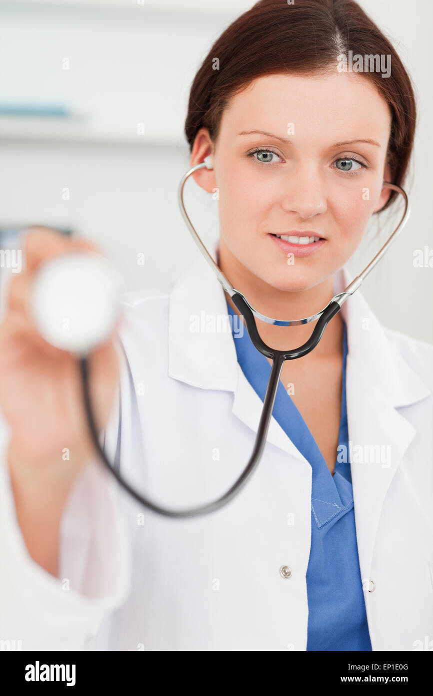 Female doctor using stethoscope Stock Photo - Alamy