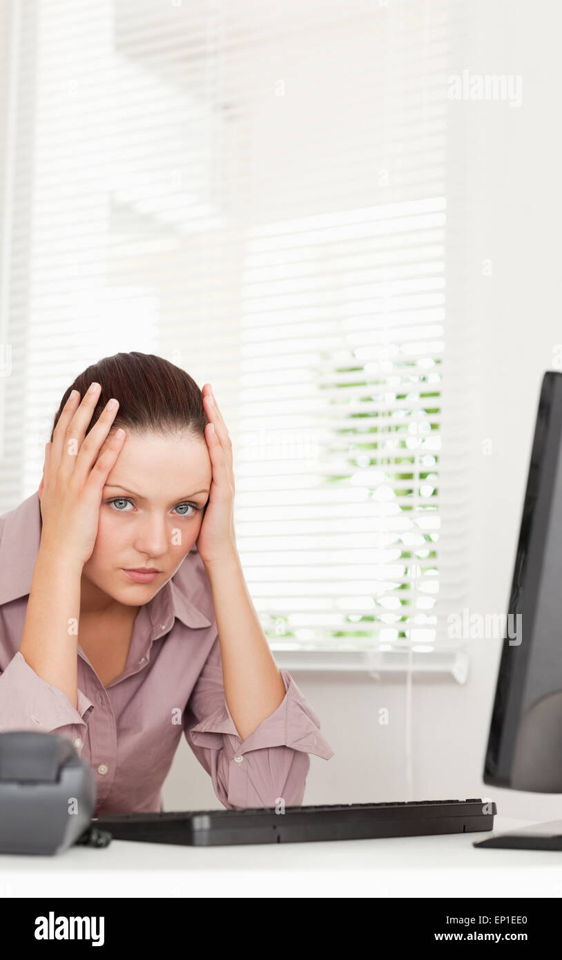 A stressed businesswoman in office Stock Photo - Alamy