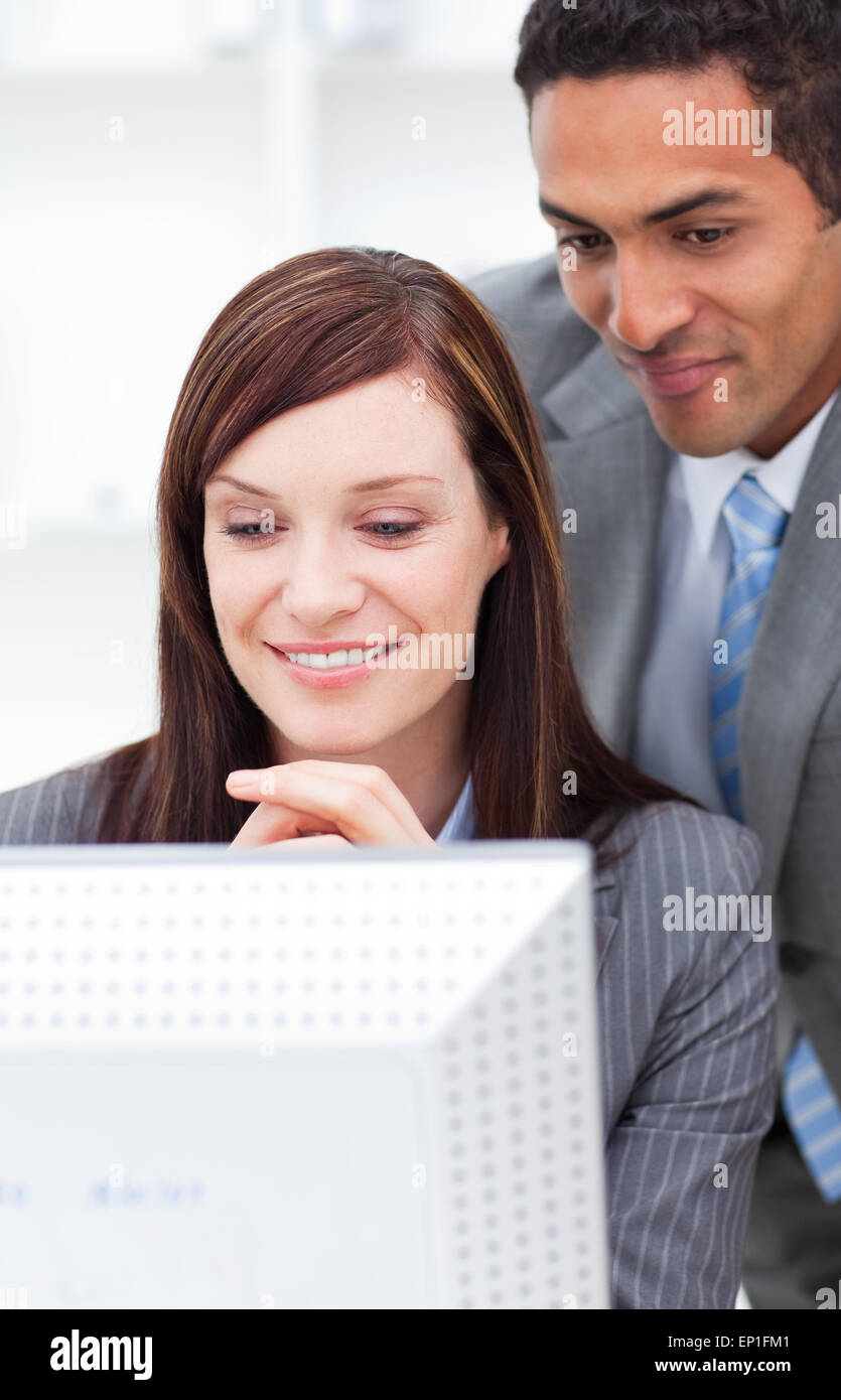 Two enthusiastic colleagues working at a computer Stock Photo - Alamy