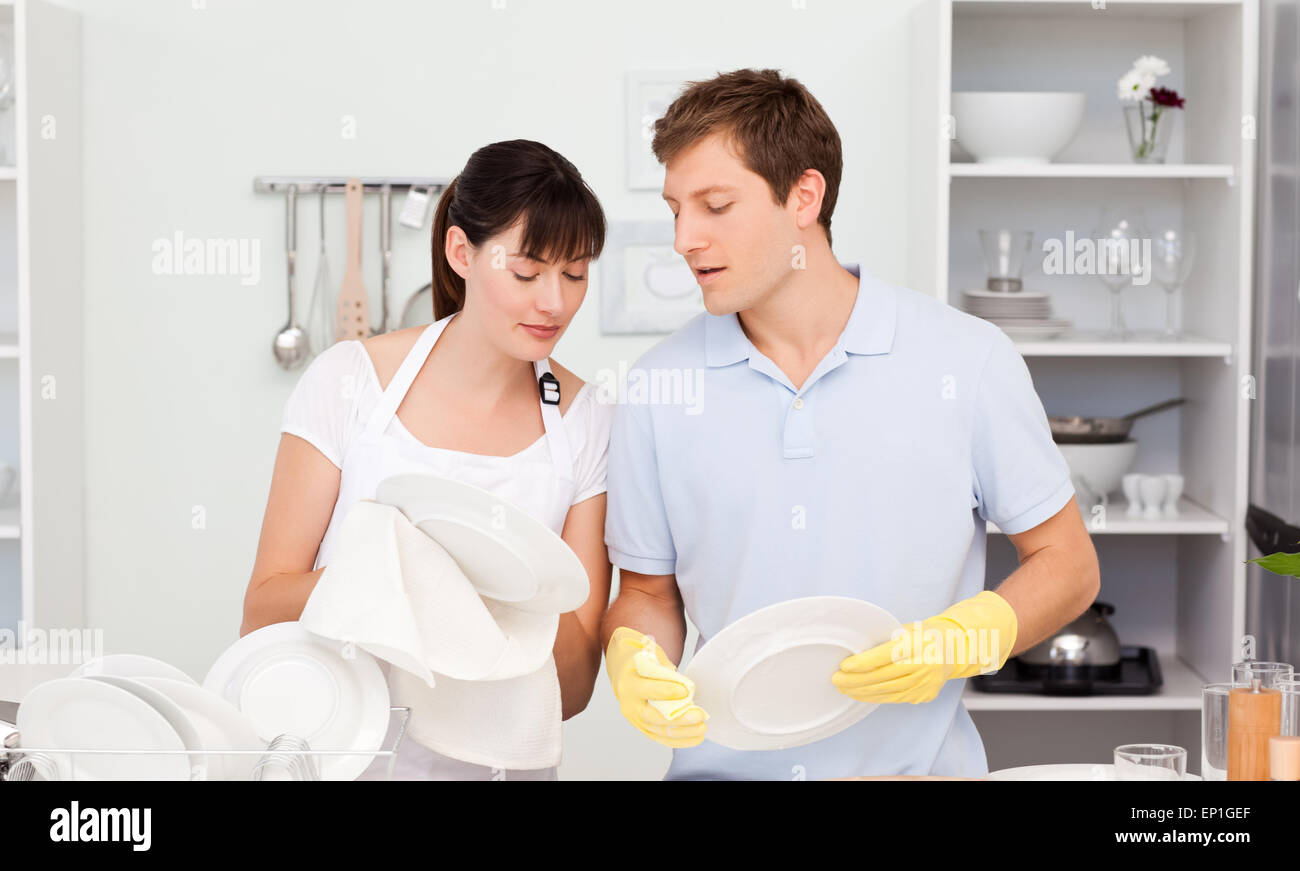Lovers washing dishes together Stock Photo Alamy