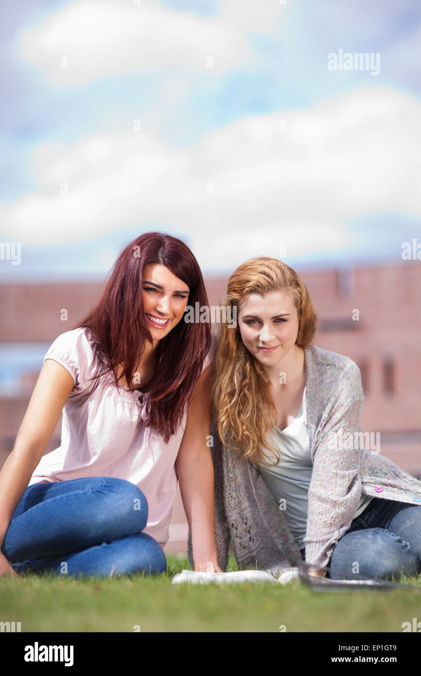Portrait of young students with a book Stock Photo - Alamy