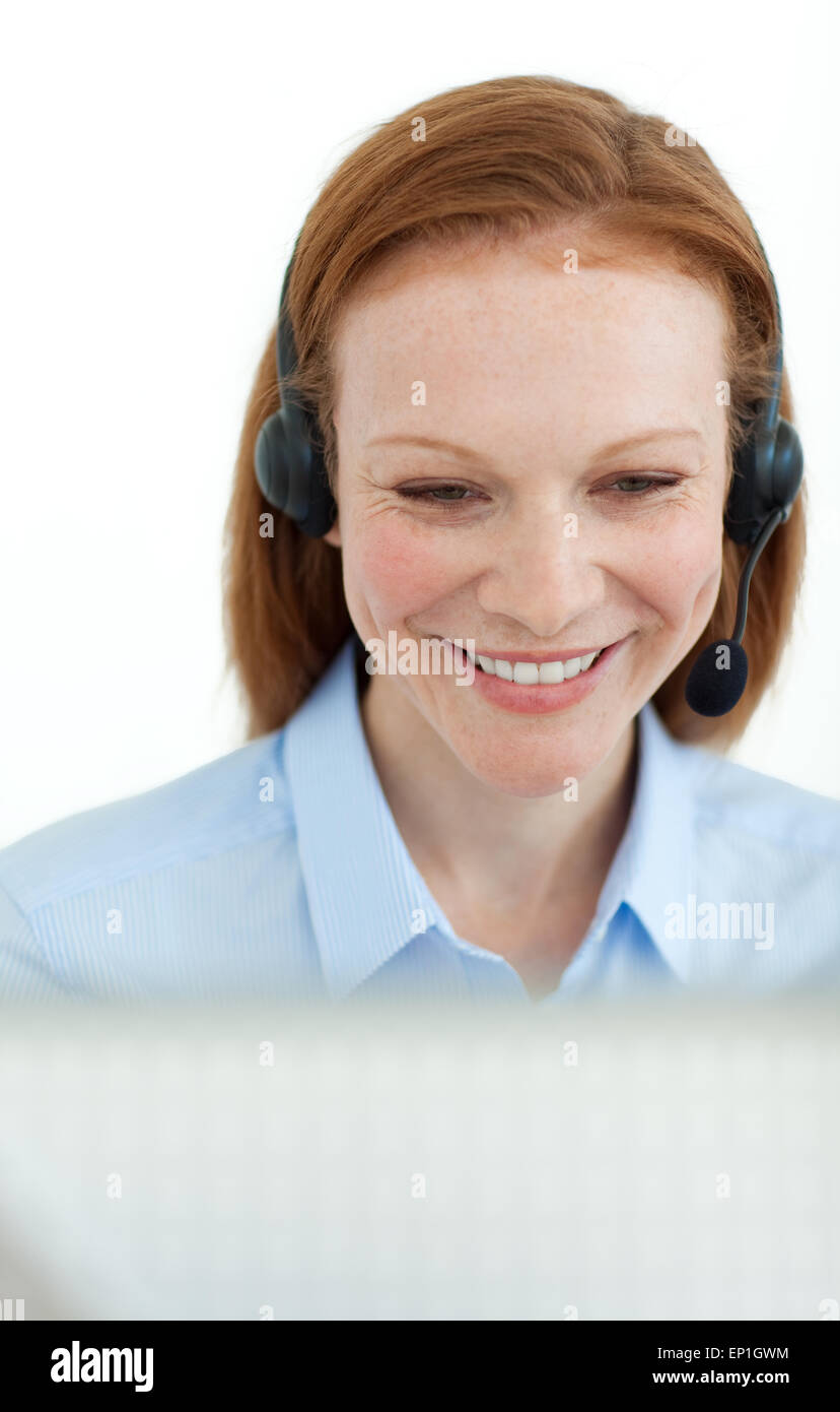 Portrait of a smiling business woman at a computer in the office Stock ...