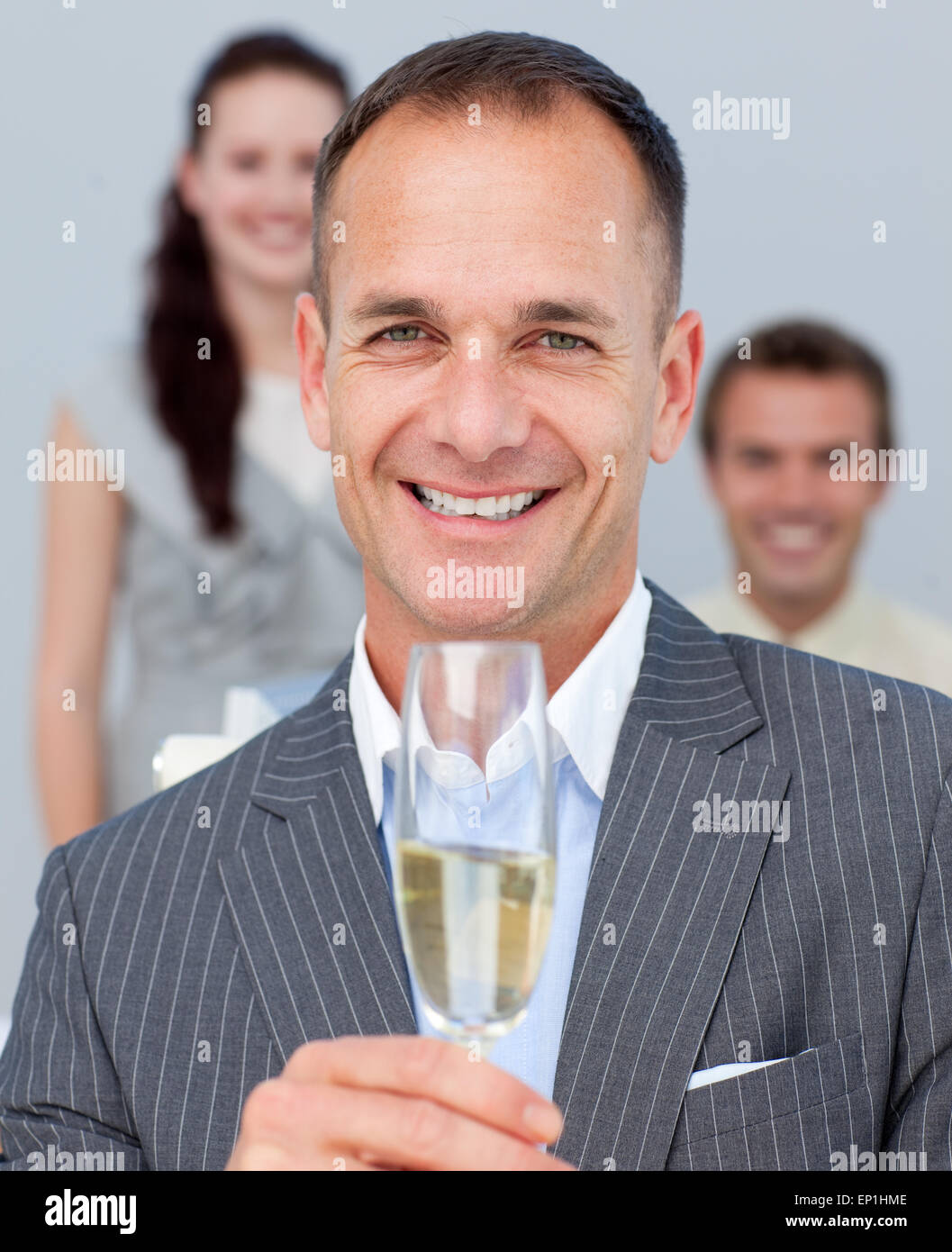 Cheerful businessman toasting with Champagne Stock Photo Alamy