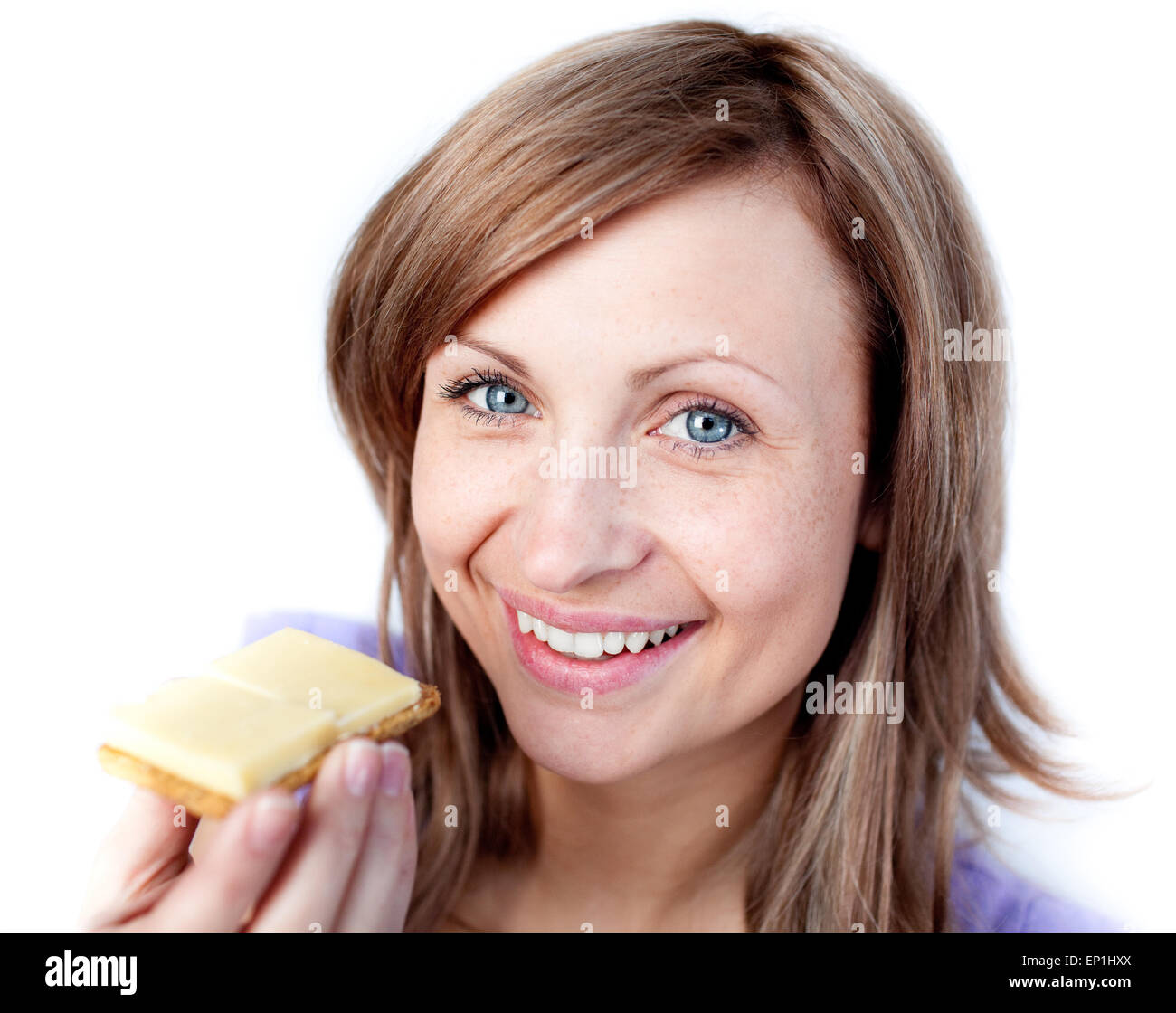 Beautiful woman eating a cracker with cheese Stock Photo Alamy