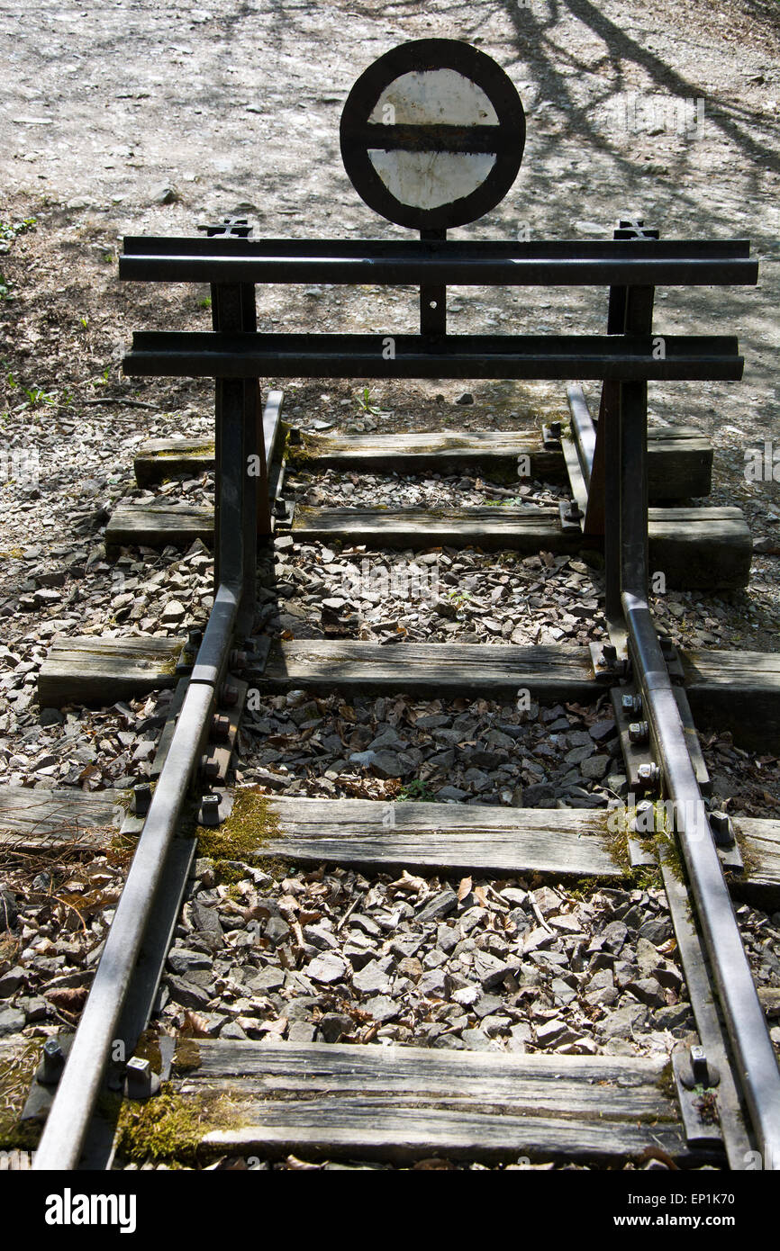 Iron buffer stop at the end of a railroad track Stock Photo