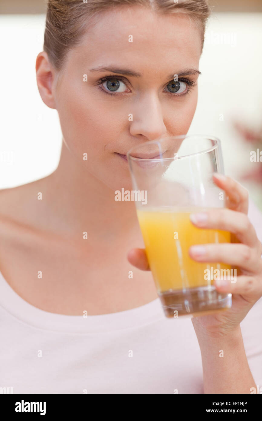 Portrait of a woman drinking juice Stock Photo Alamy