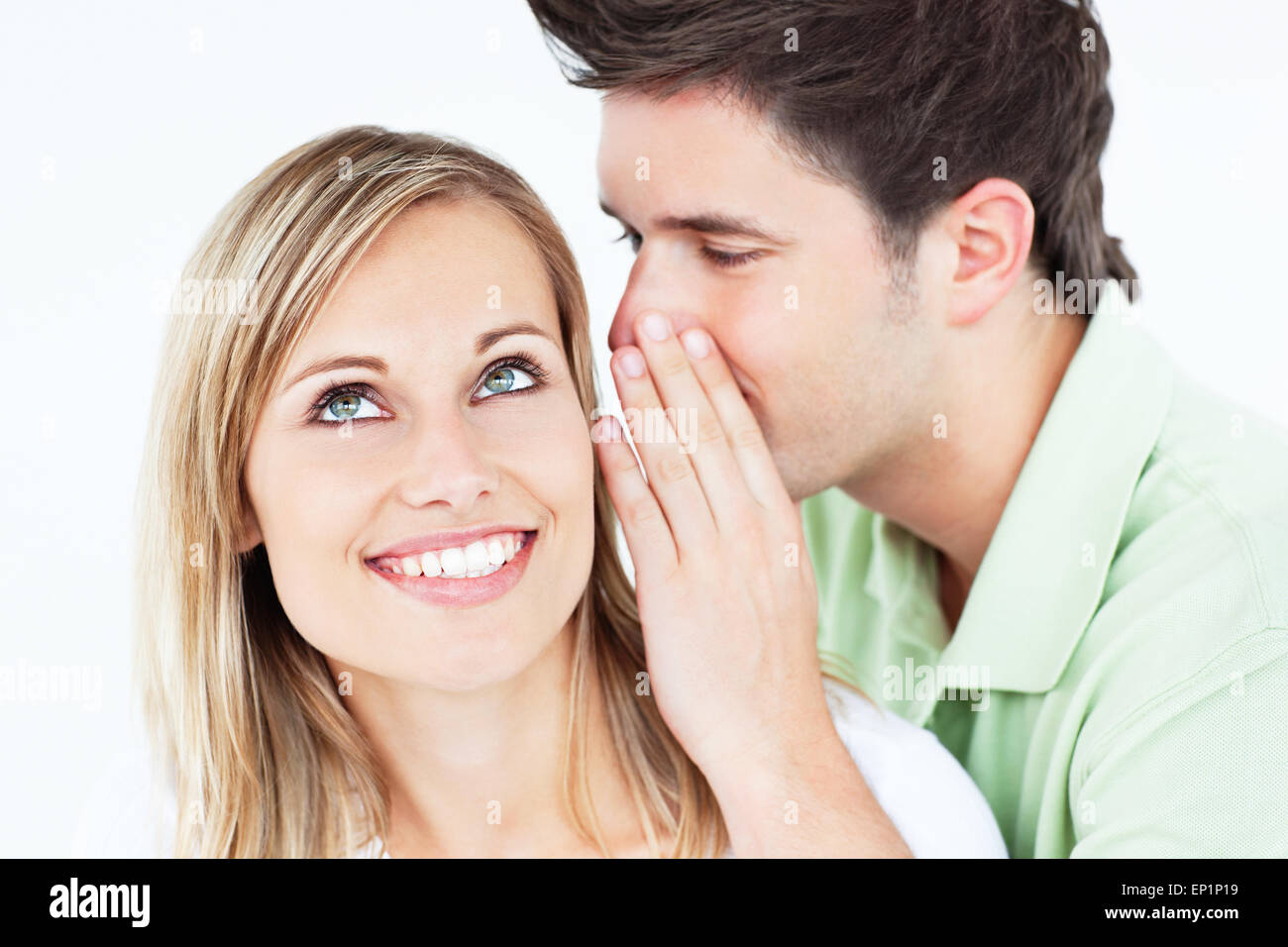 Young man woman whispering something hi res stock photography and