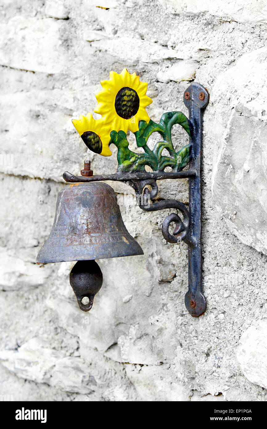 vintage italian doorbell with clapper on ancient villa wall Stock Photo