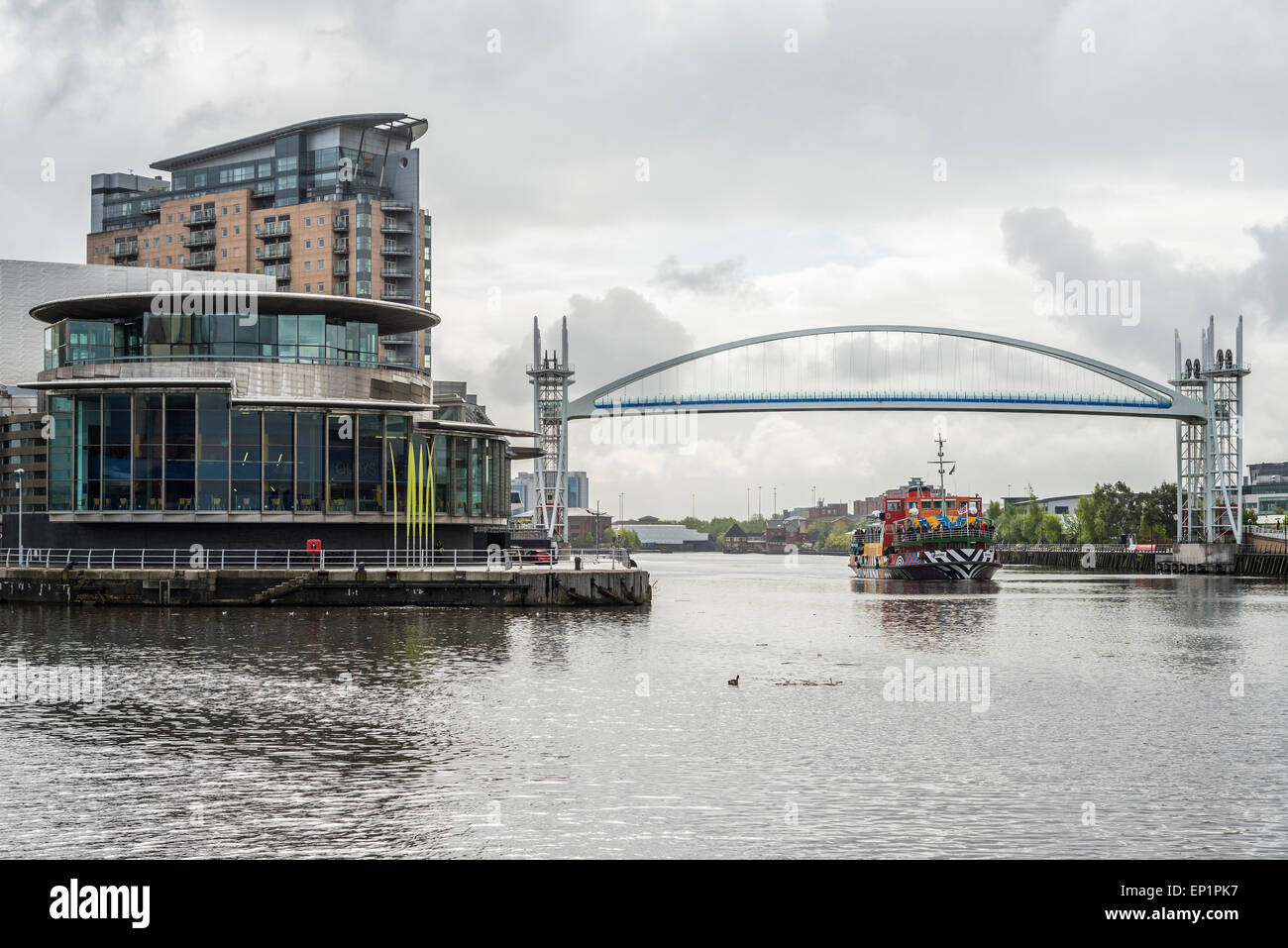 The Lowry Centre Salford Quays. The Mersey ferry Snowdrop painted in Dazzle camouflage. Stock Photo
