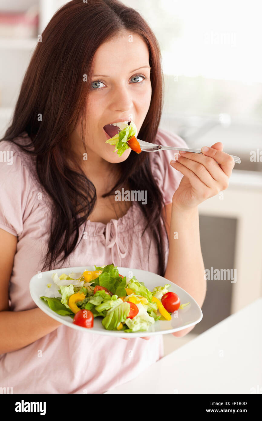 Woman eating salad Stock Photo Alamy