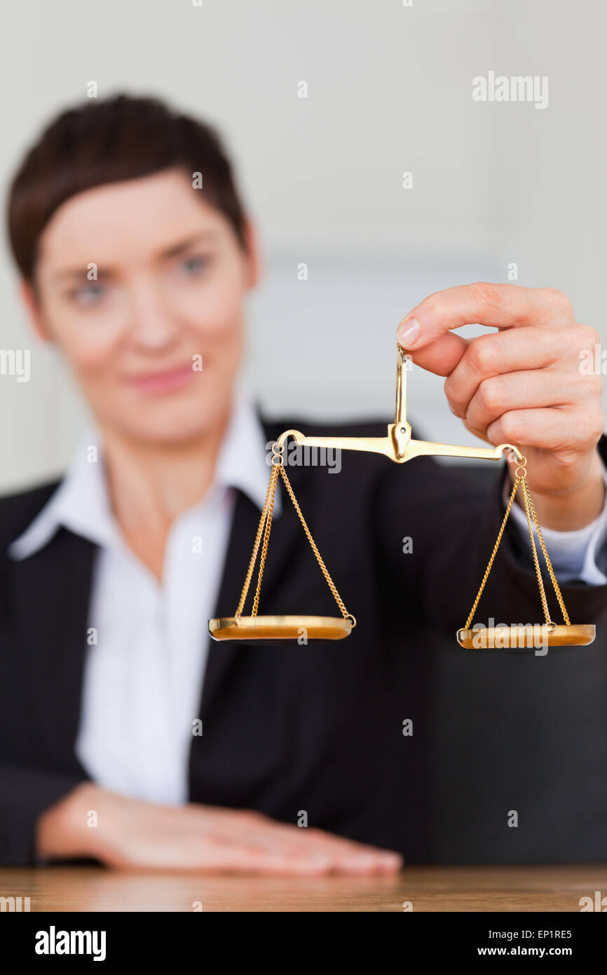 Portrait of a businesswoman holding the justice scale Stock Photo