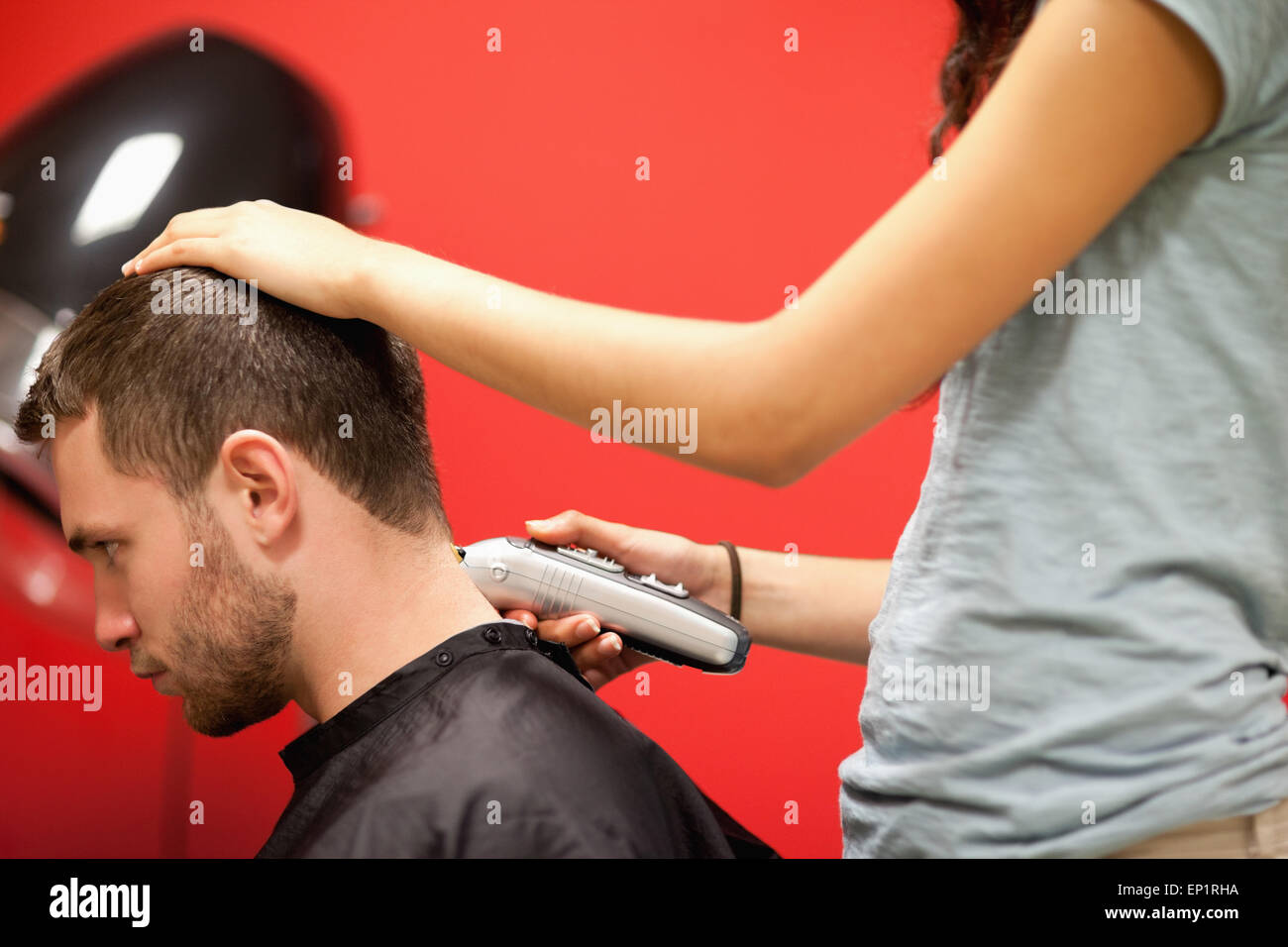 Male student having a haircut Stock Photo Alamy
