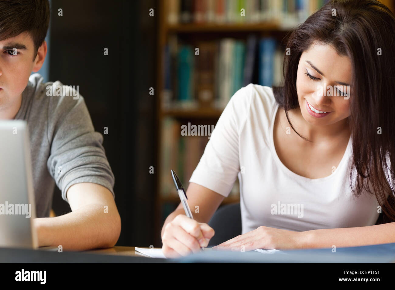 Students writing a paper Stock Photo - Alamy