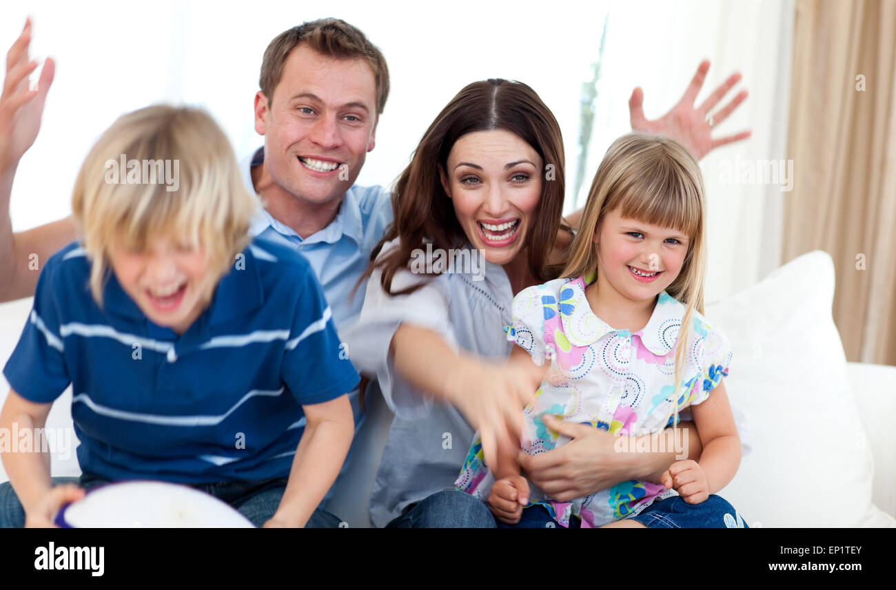 Excited family celebrating a goal Stock Photo