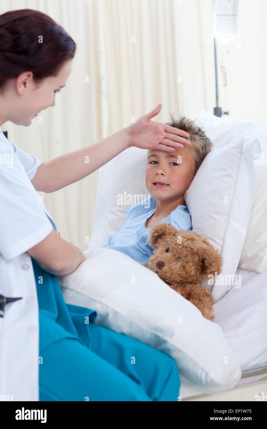 Female doctor checking child temperature Stock Photo Alamy
