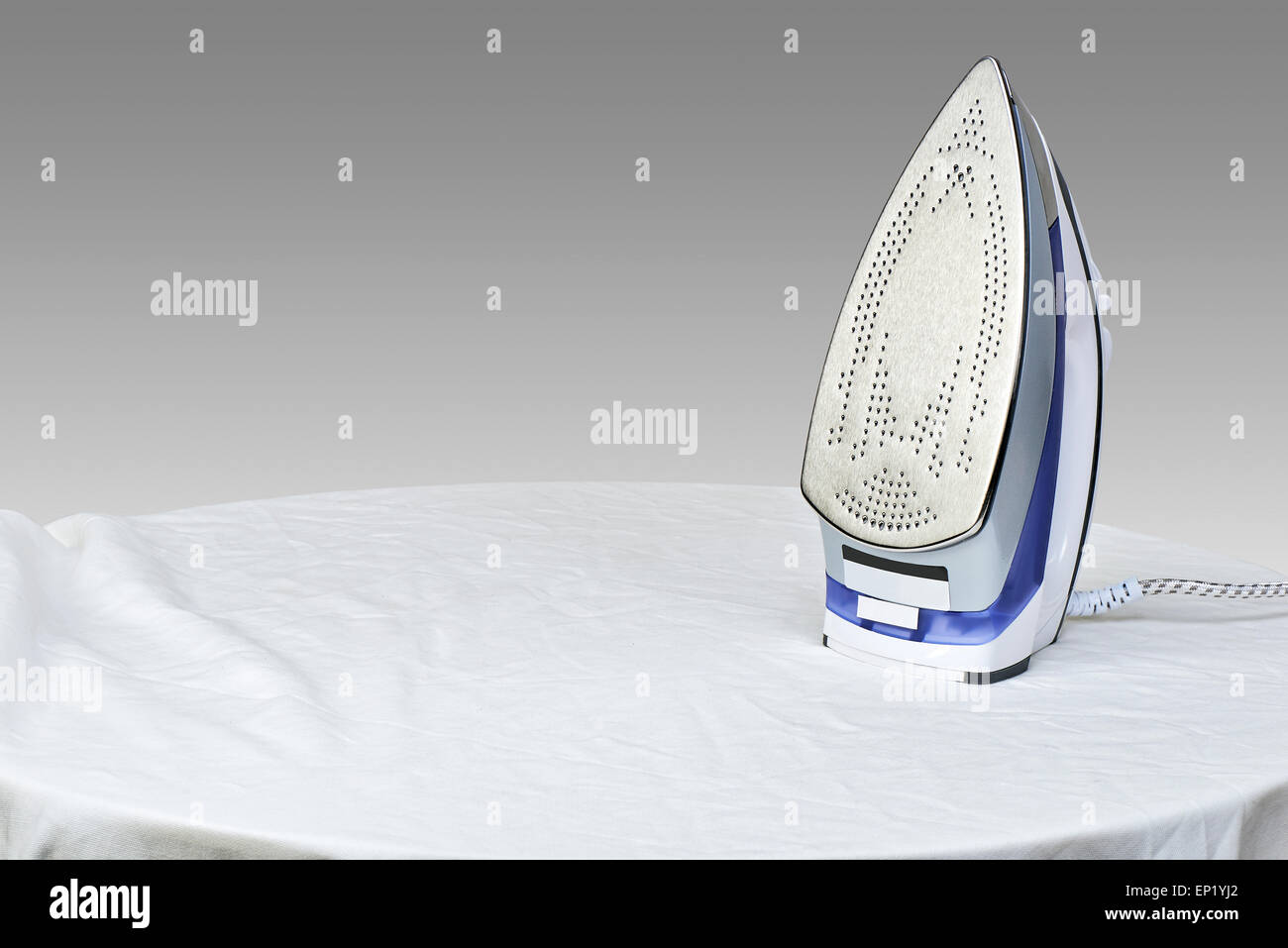 Preparing to steam iron for smooth out the wrinkles Stock Photo Alamy