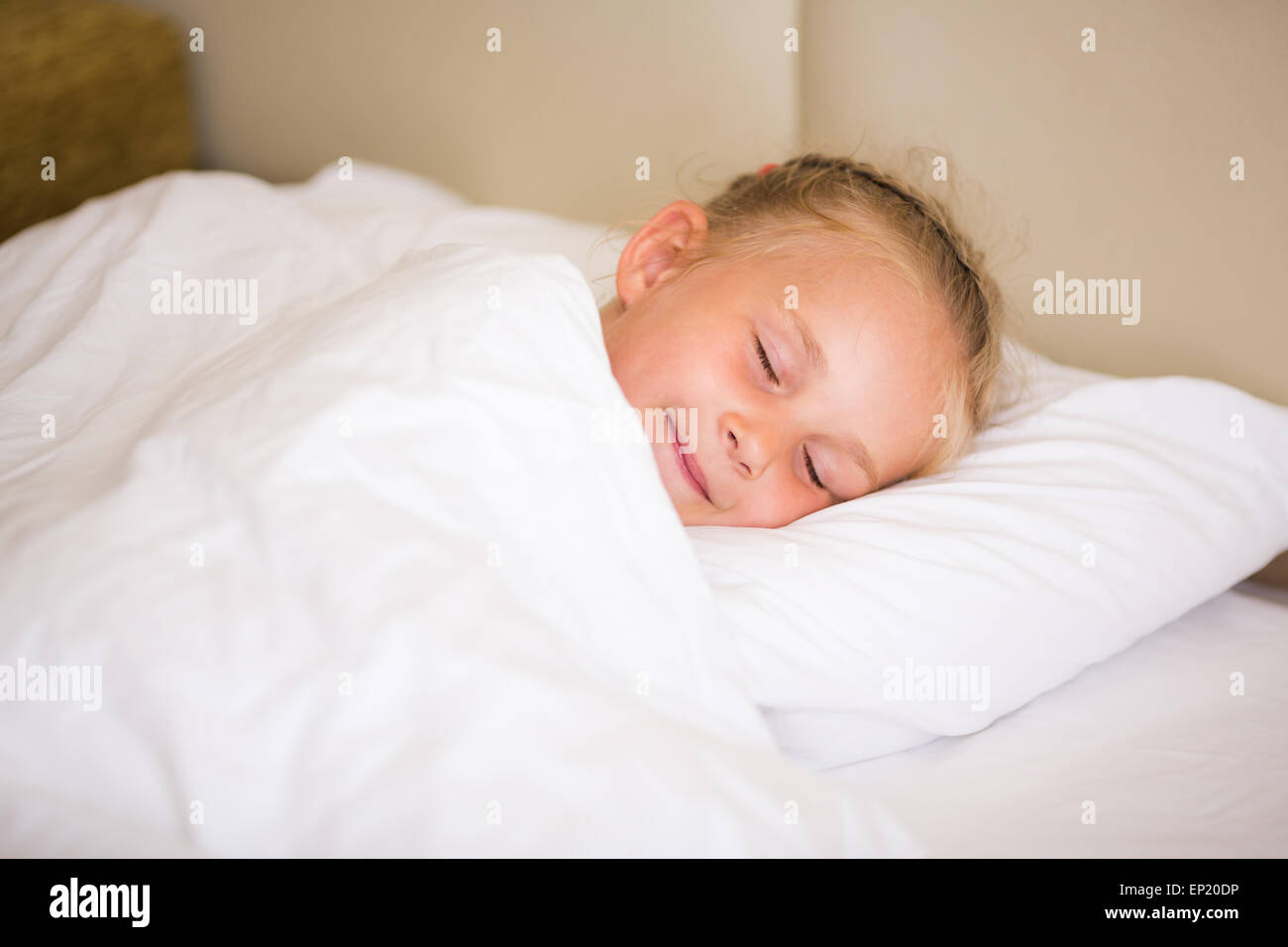 Adorable little girl sleeping in the bed Stock Photo - Alamy
