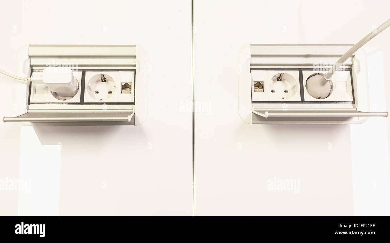 Modern and simple electric plugs with network connections. Stock Photo