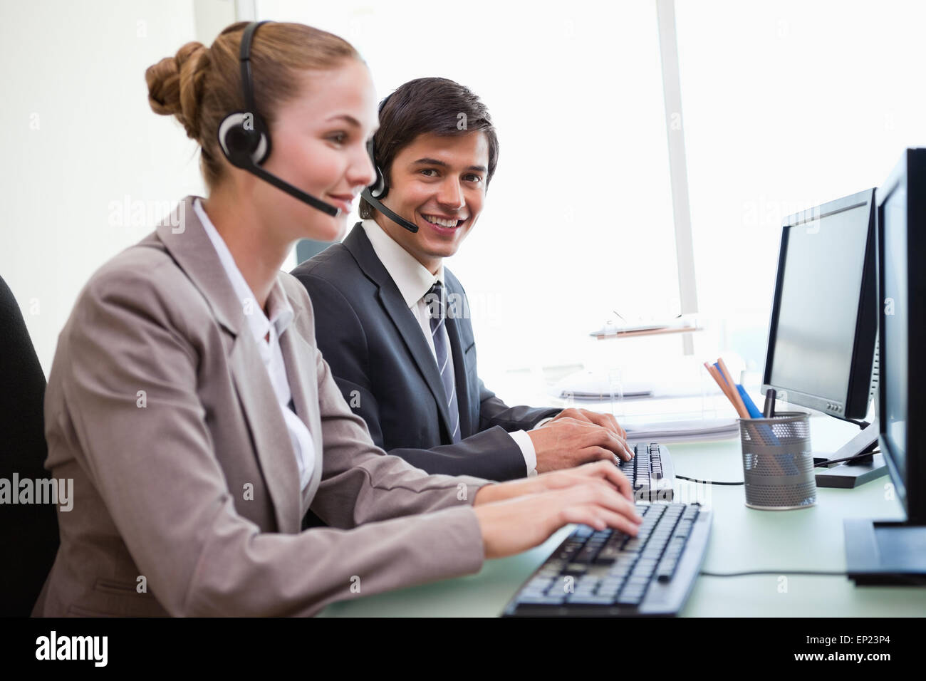 Office workers using computers Stock Photo - Alamy