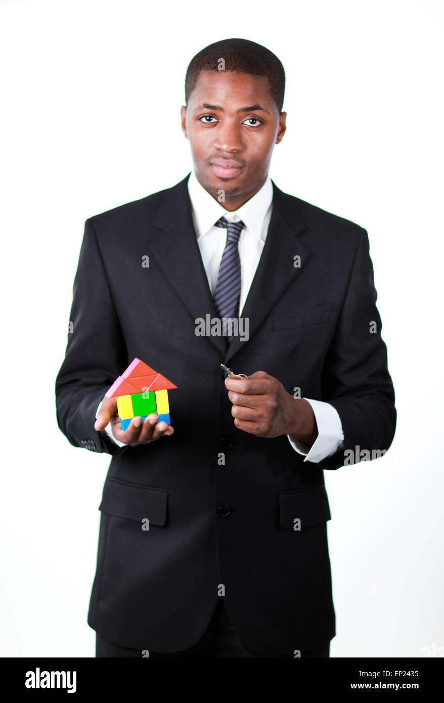 Confident businessman with a house for an real estate concept Stock ...