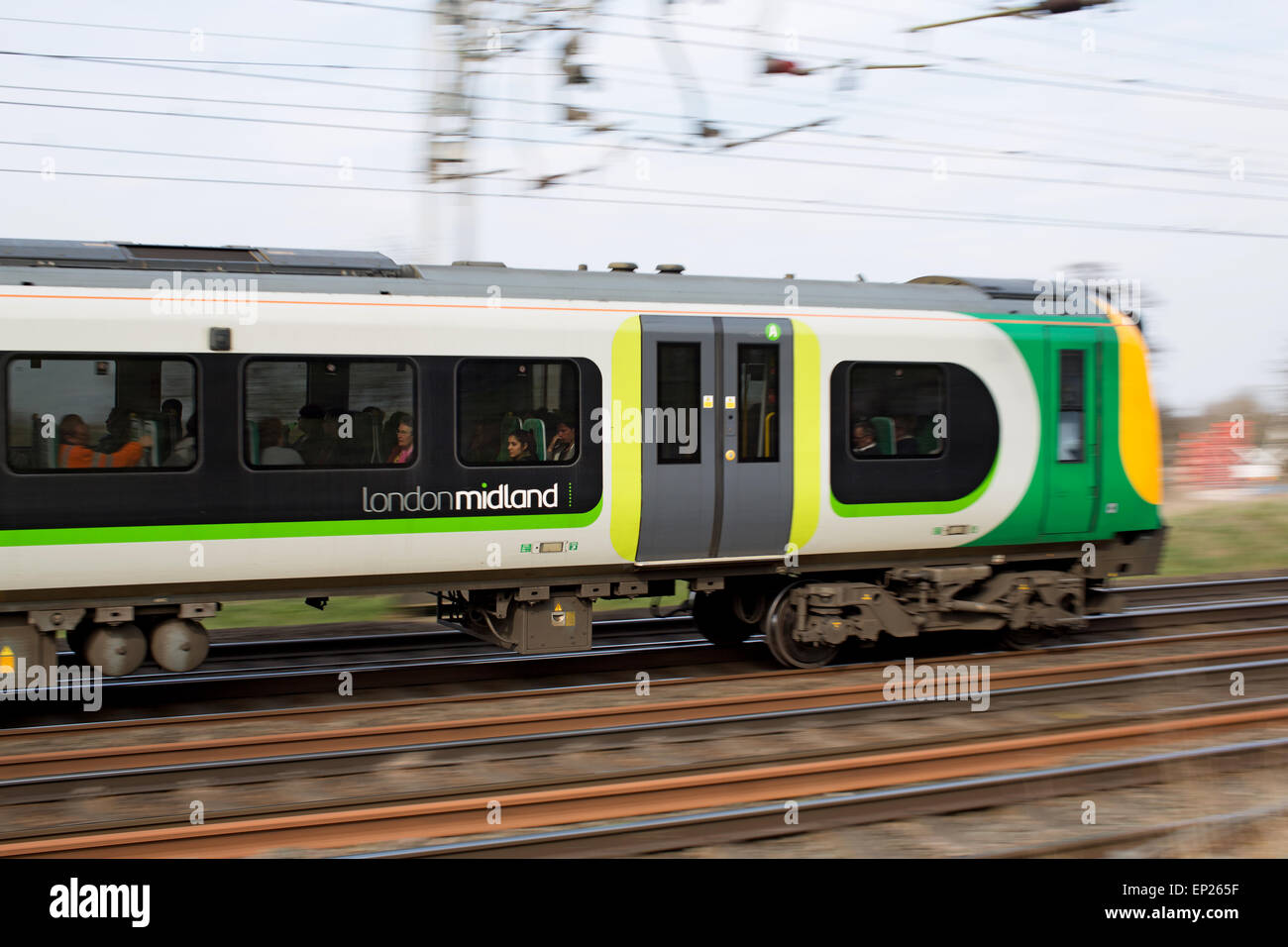 A London Midland commuter train in motion Stock Photo