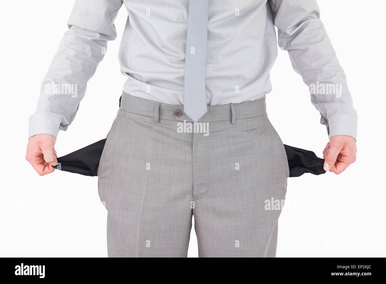 Businessman showing his empty pockets Stock Photo Alamy