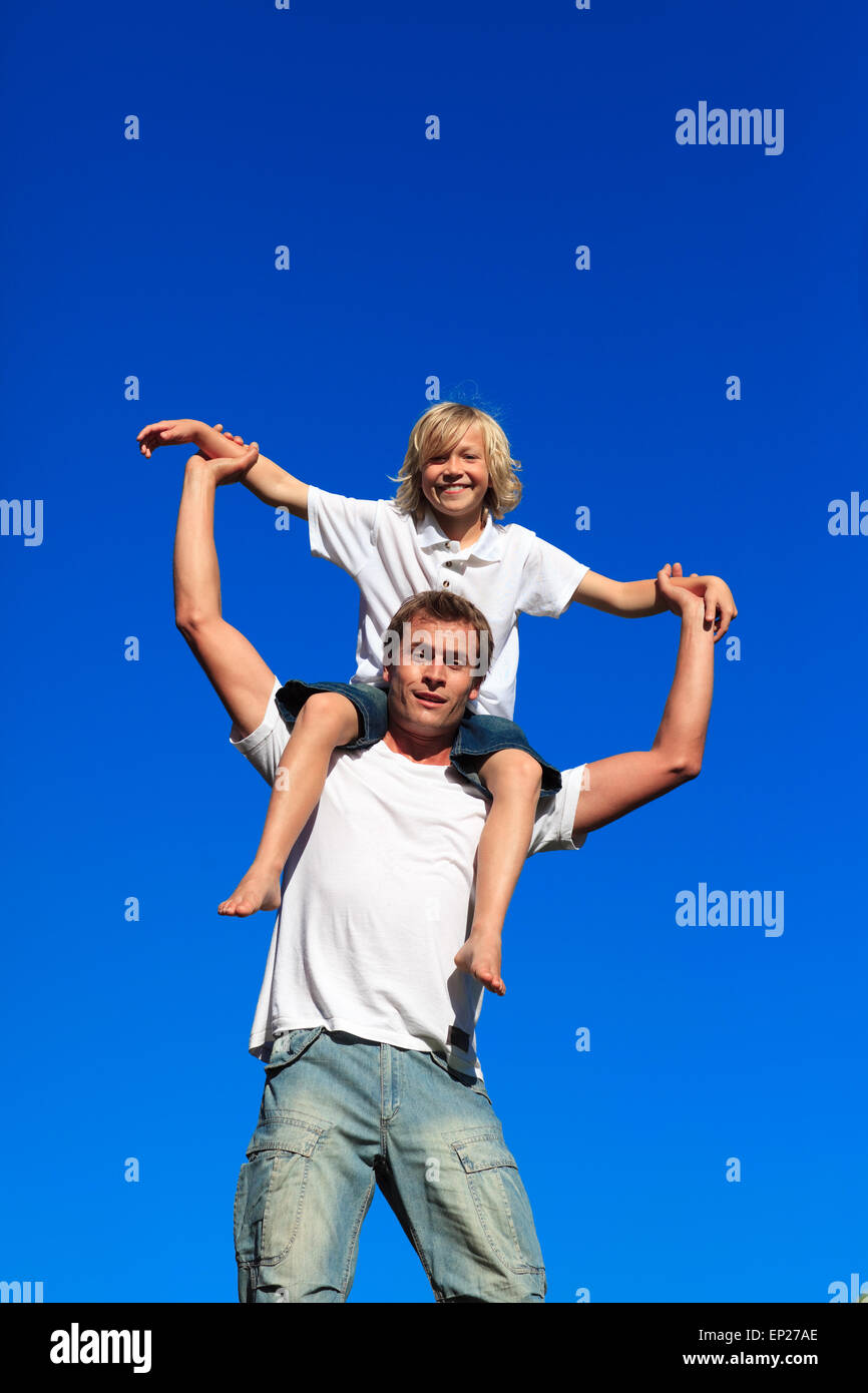 Dad giving son piggyback ride hi-res stock photography and images - Alamy