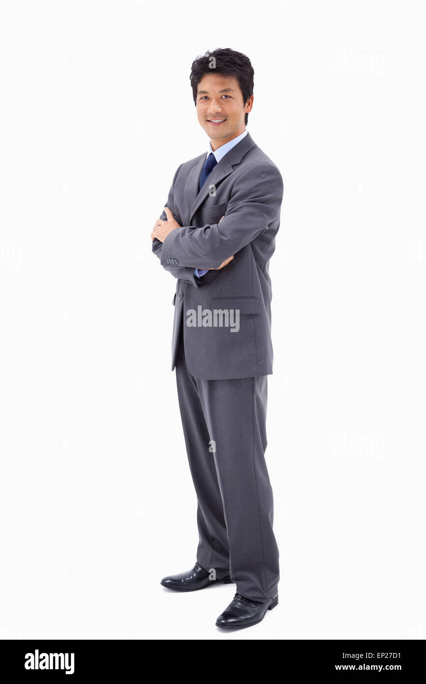 Portrait of a smiling businessman with the arms crossed Stock Photo - Alamy
