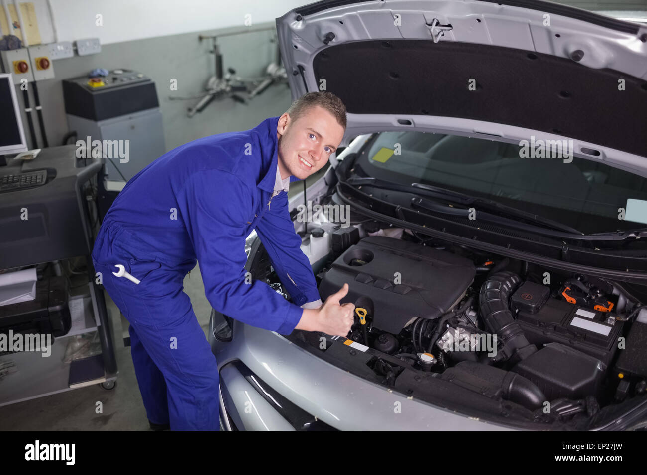 Mechanic with hands on hood of car hi-res stock photography and images ...