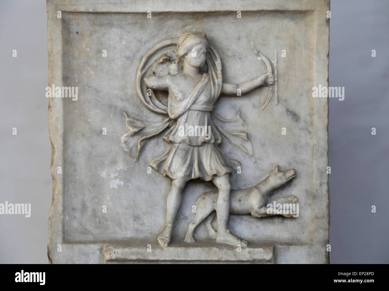 Altar dedicated to Diana victrix by Aebutia Amerina, representing Artemis as an archer running. Marble. 2nd C. AD. Rome. Stock Photo