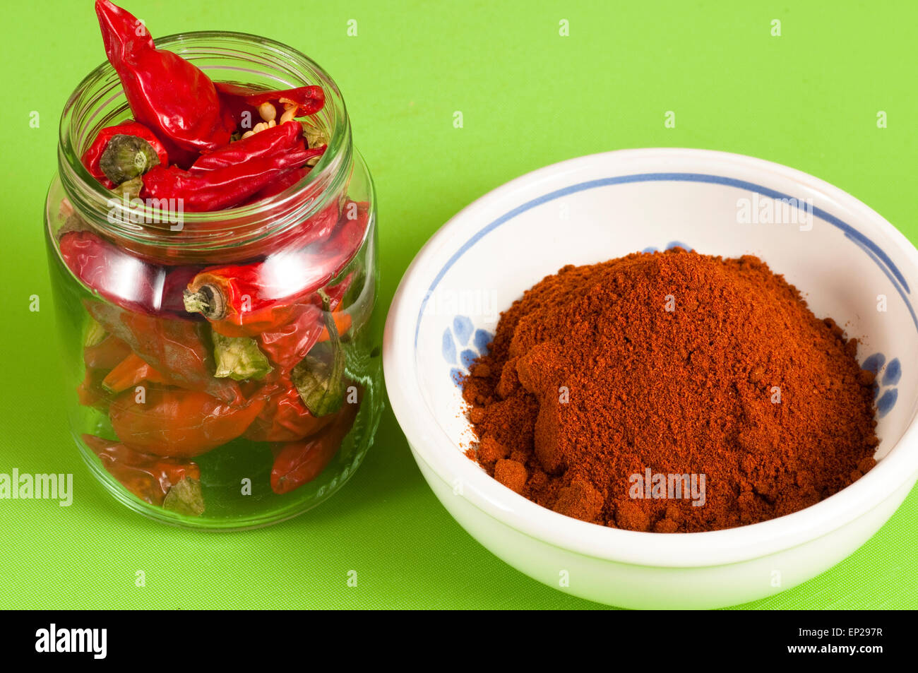 red hot chili peppers whole and ground Stock Photo Alamy