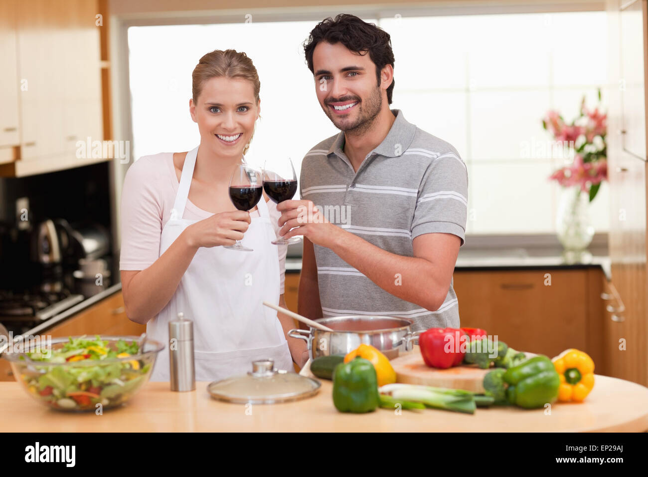 Couple drinking a glass of red wine Stock Photo - Alamy