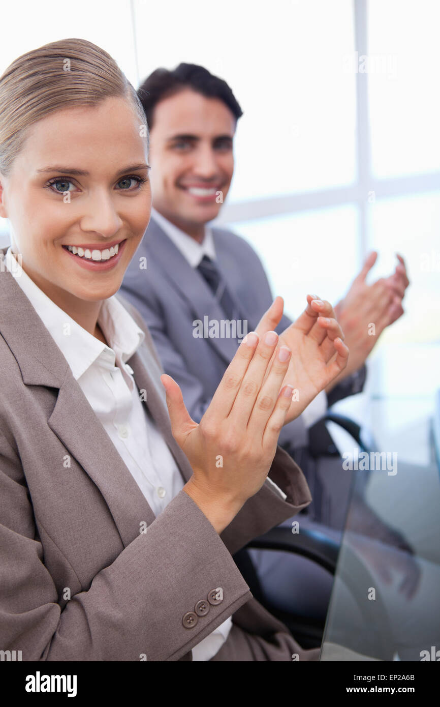 Two young women clapping their hands hi-res stock photography and ...