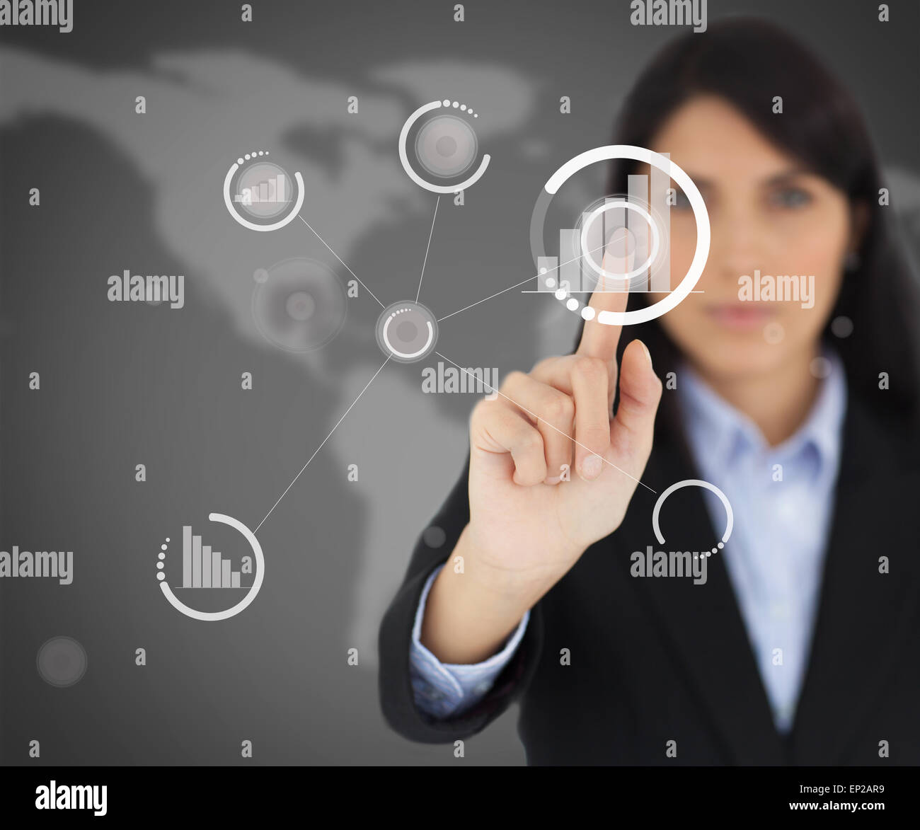 Businesswoman touching one button on black screen Stock Photo