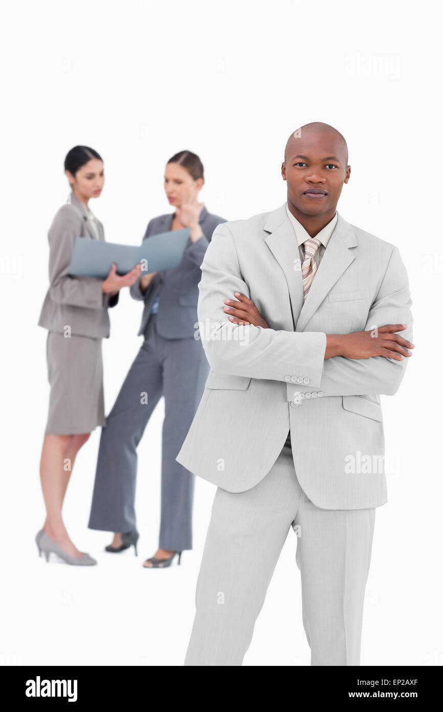 Confident tradesman with colleagues behind him Stock Photo - Alamy