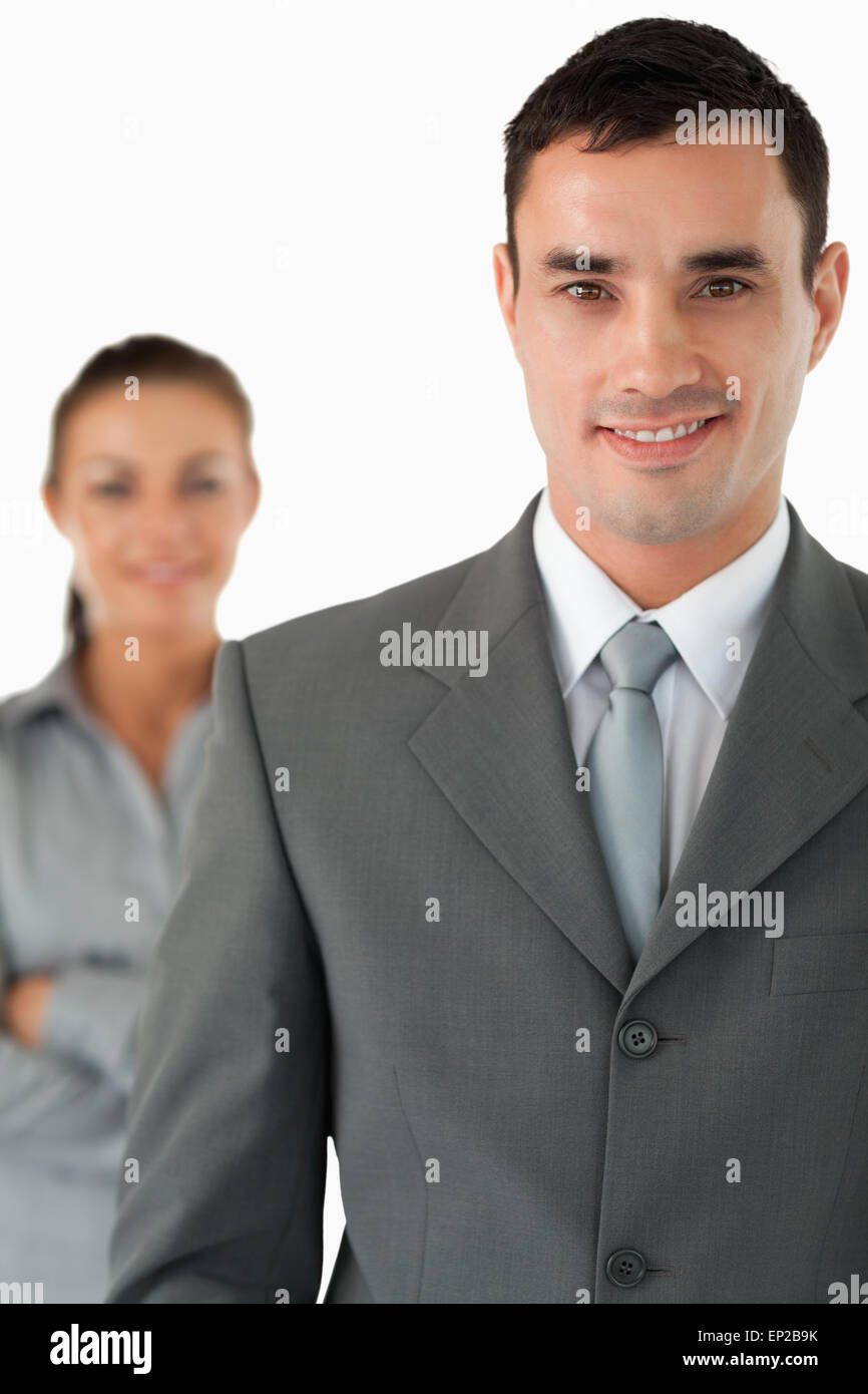 Close up of smiling businessman with colleague behind him Stock Photo ...