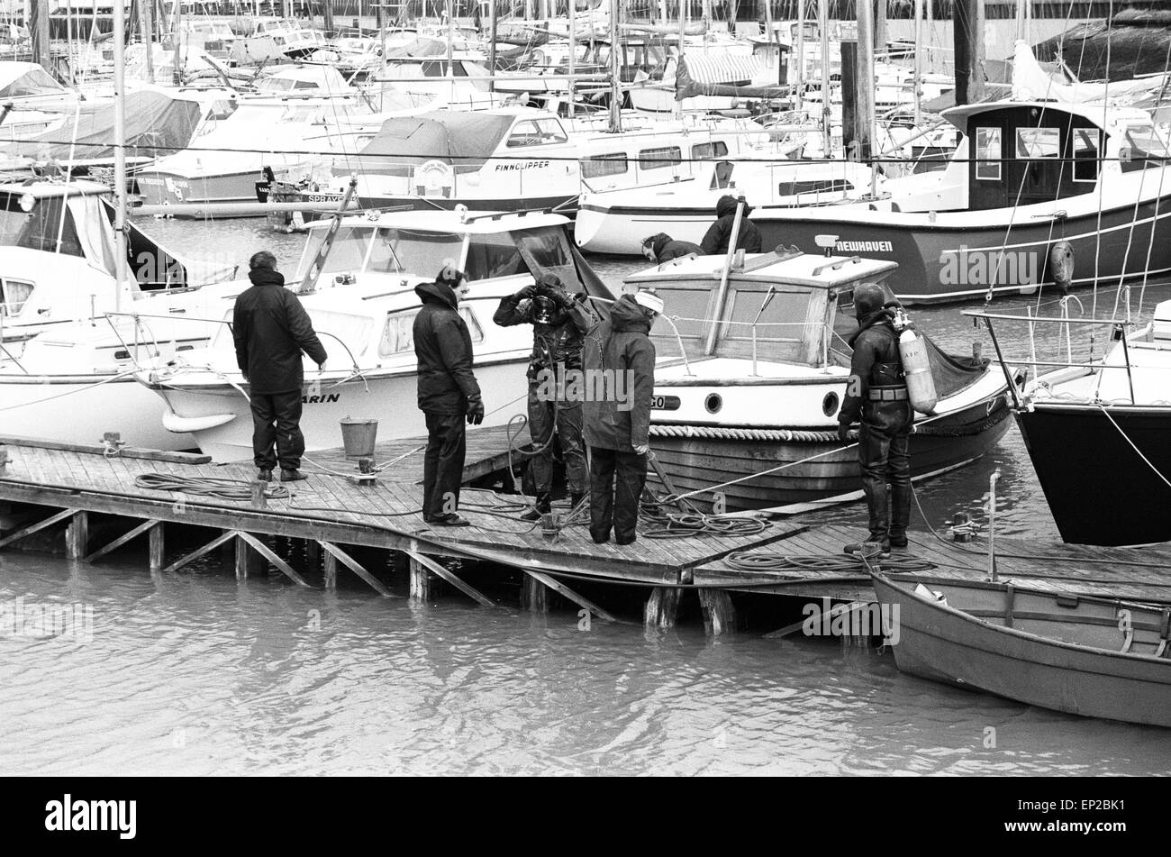 Police Manhunt in Newhaven Sussex 27th November 1974. Police divers at work at Cresta marina for missing Lord Lucan now wanted on murder charge.Richard John Bingham 7th Earl of Lucan popularly known as Lord Lucan was British peer who disappeared in the early hours of 8 November 1974 following the murder of Sandra Rivett his children's nanny the previous evening. There has been no verified sighting of him since then. On 19th June 1975 an inquest jury named Lucan as the murderer of Sandra Rivett.He was presumed deceased in chambers on 11th December 1992 and declared legally dead in October 1999. Stock Photo