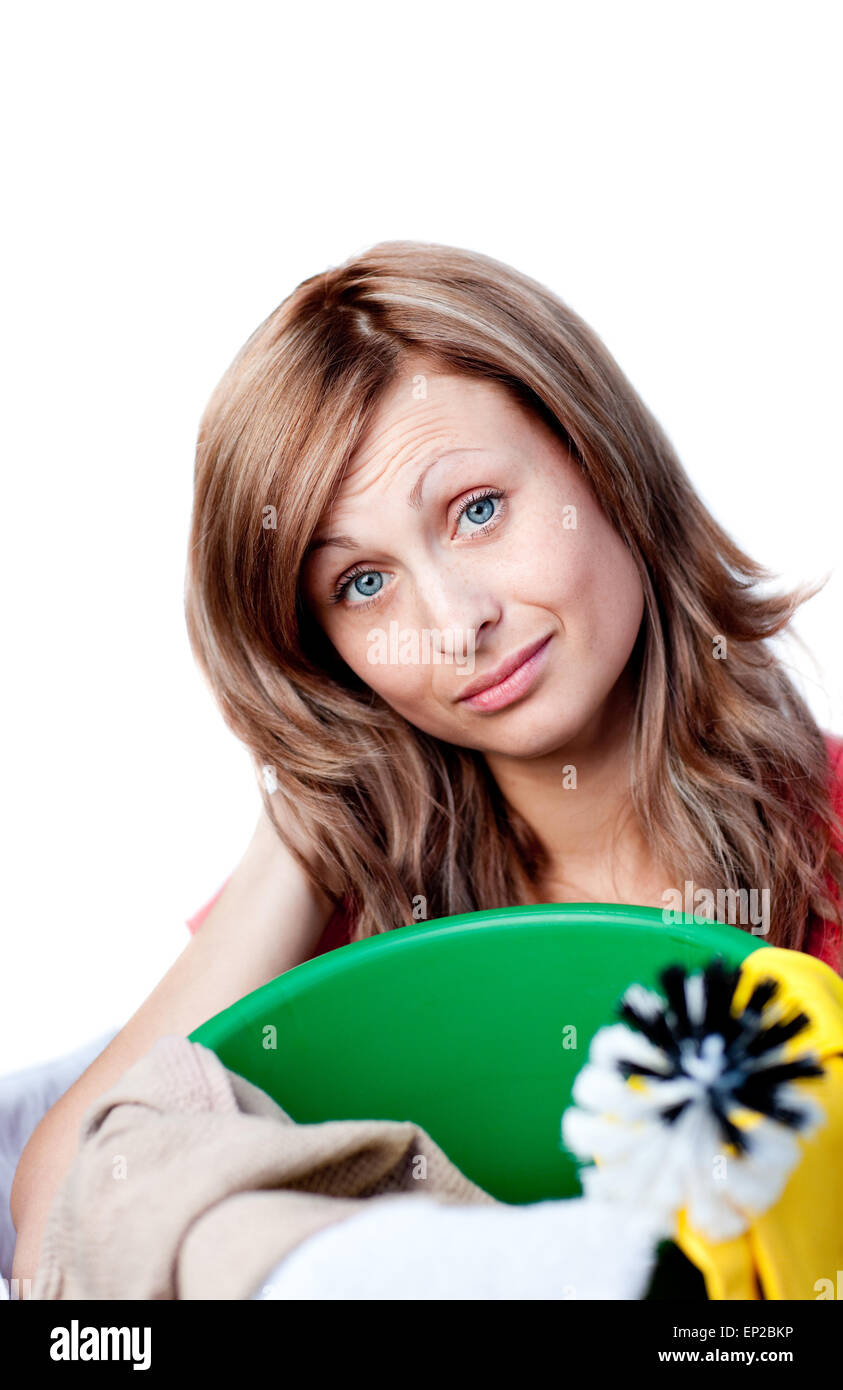 Portrait of a happy woman doing housework against a white background ...