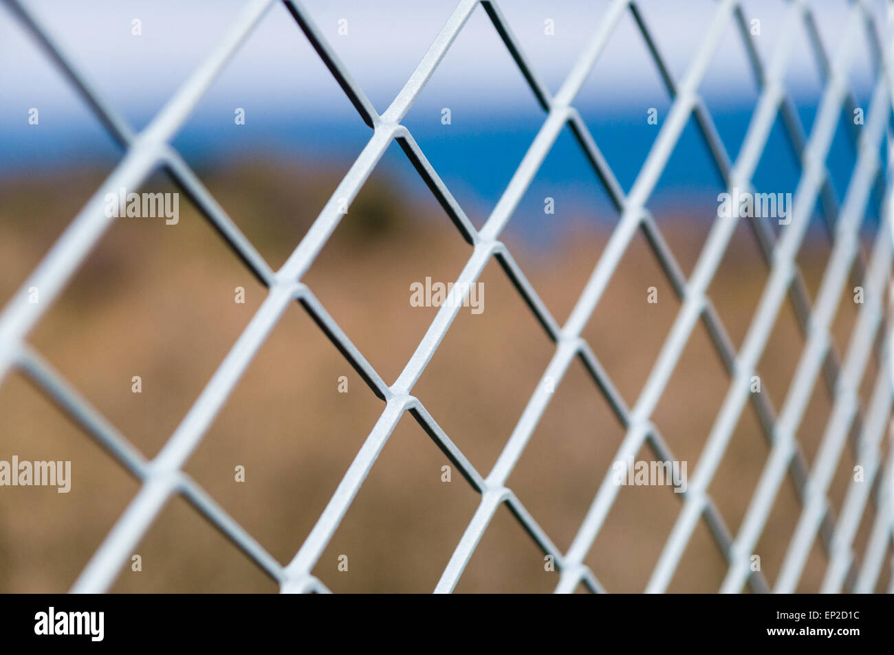 Solid metallic mesh fence Stock Photo
