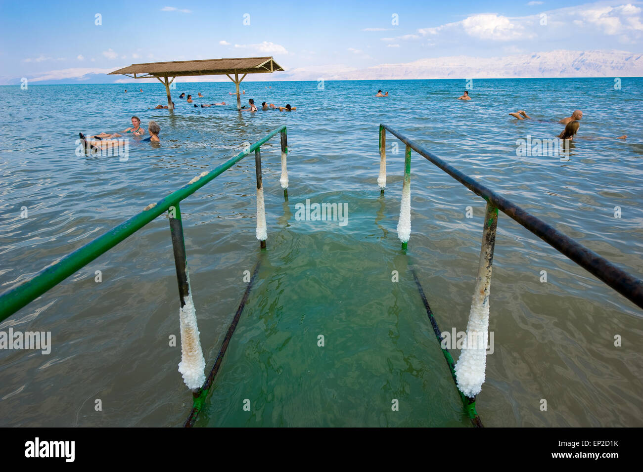 DEAD SEA, ISRAEL - OCT 13, 2014: People are floating in the water of the dead sea in Israel Stock Photo