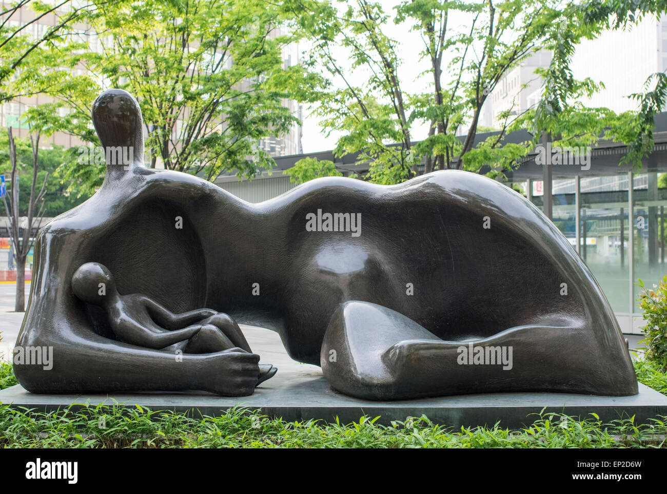 Draped Reclining Mother and Baby Bronze Statue by Sculptor Henry Moore, Hakata Station, Fukuoka, Japan. Stock Photo