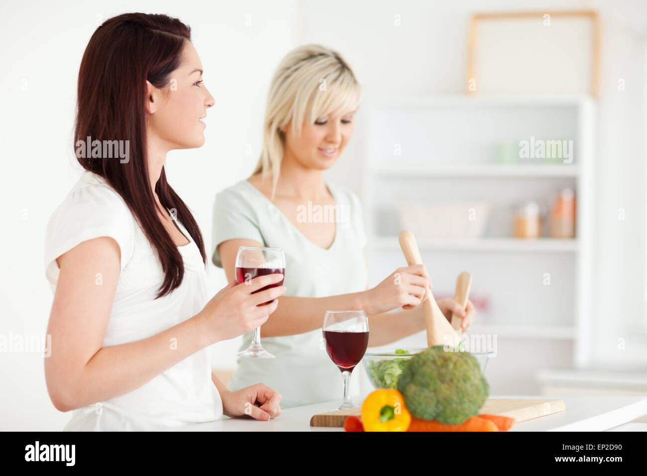 Happy Women cooking dinner Stock Photo