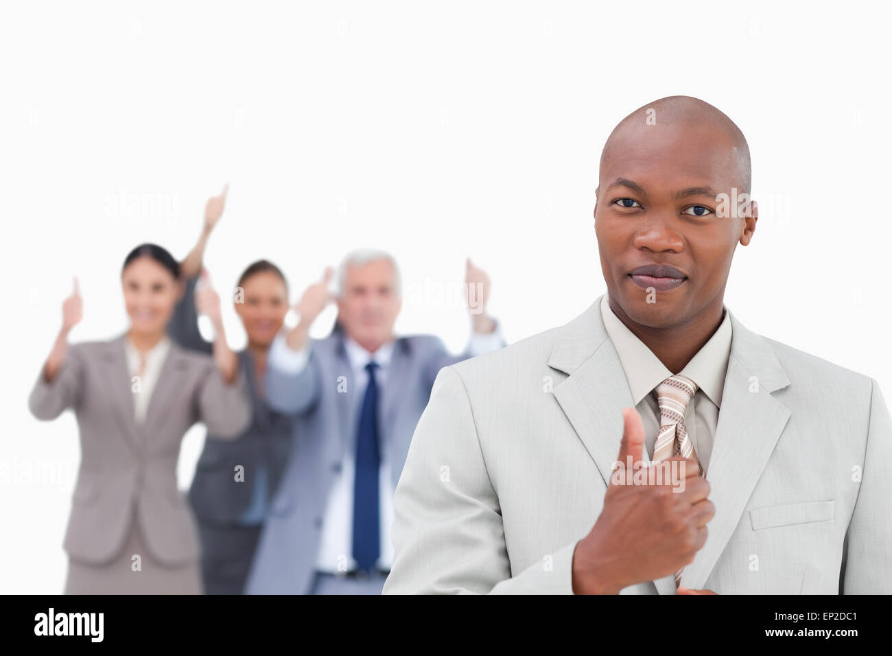 Businessman with cheering team behind him giving thumb up Stock Photo ...